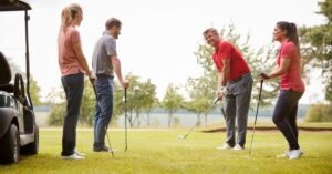 A group of people playing a golf scramble